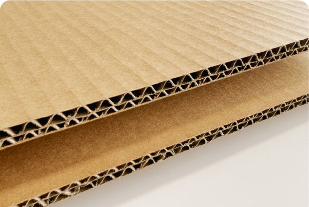 Corrugated cardboard sheets for packaging and shipping solutions.