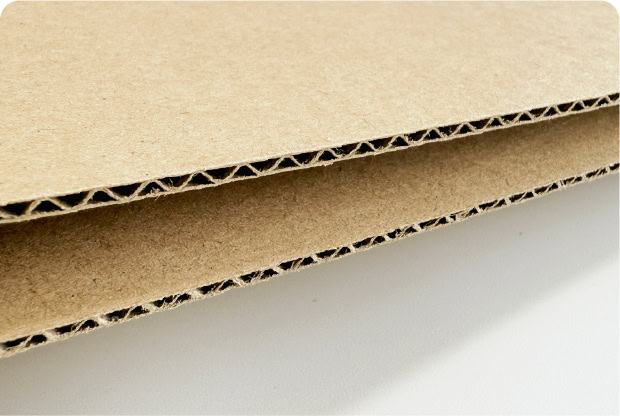 Corrugated cardboard sheets for packaging and shipping.