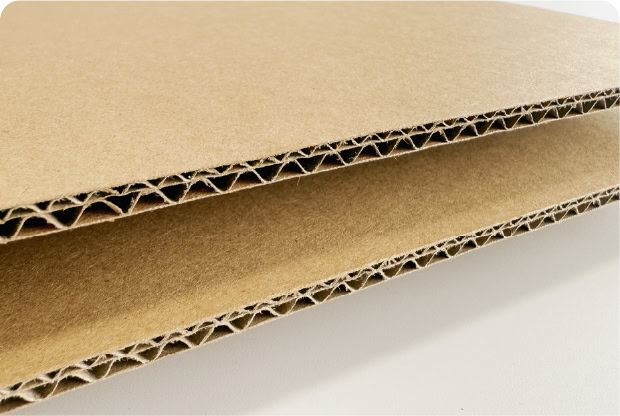 Corrugated cardboard packaging material for eco-friendly shipping and packing solutions.